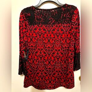 Rich red/black print top with black fabric-lace trim at neck and on sleeves